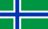 Describes the South Uist Flag: a blue Scandinavian cross edged in white on a green field